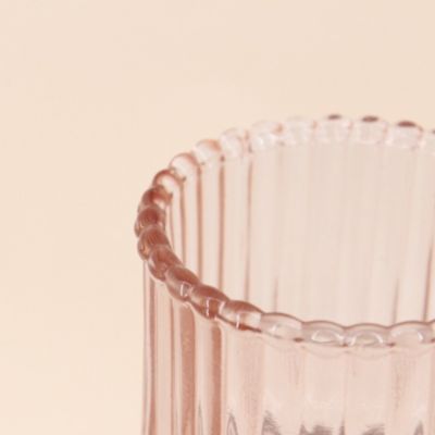 Bougeoir en verre strié rose 19cm