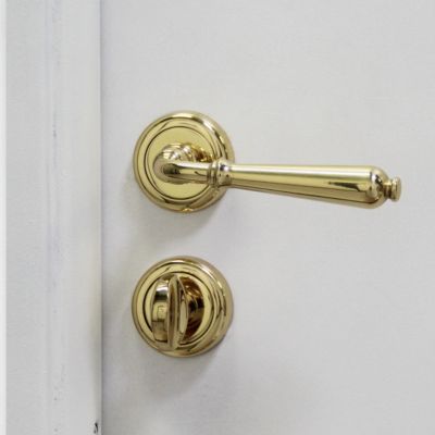 Ensemble poignée de porte sur rosace cône à visser daumesnil Chrisligne poli verni doré Ø50mm