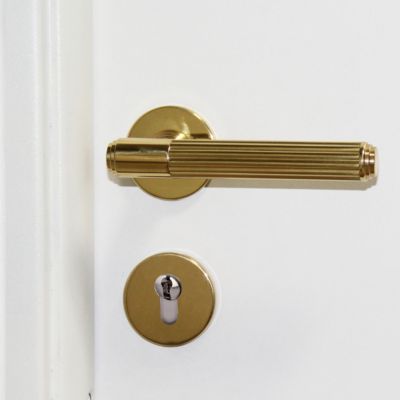 Ensemble poignée de porte sur rosace droit à visser couronne Chrisligne poli verni doré Ø50mm