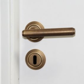 Ensemble poignée de porte sur rosace droit à visser grenelle Chrisligne vieilli bronzé Ø56mm