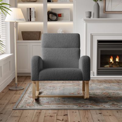 Fauteuil à bascule en tissu teddy noir avec poches latérales, assise large et patins antidérapants silencieux
