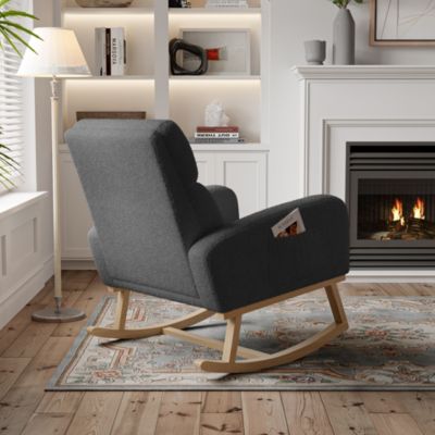 Fauteuil à bascule en tissu teddy noir avec poches latérales, assise large et patins antidérapants silencieux