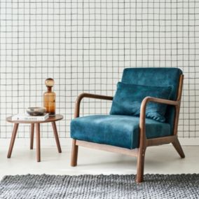 Fauteuil en velours bleu pétrole. pieds bois d'hévéa teinté noyer clair. 1 place droit fixe. pieds compas scandinave