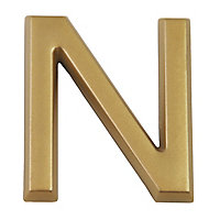 Lettre dorée "N" en relief