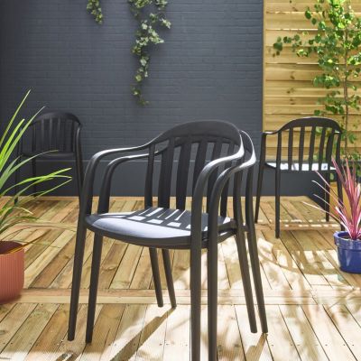 Lot de 4 fauteuils de jardin plastique noir. empilables