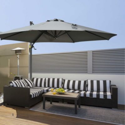 Parasol déporté octogonal inclinable rotatif manivelle piètement acier mât alu. dia. 2,95 x 2,5H m polyester haute densité