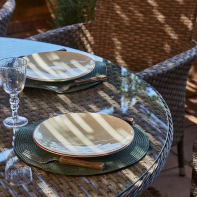 Set de repas table de jardin ronde D140 cm et 4 chaises rotin synthétique et aluminium - Bolonia