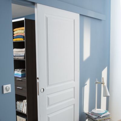 Système coulissant pour porte en bois