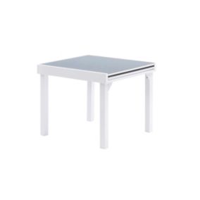 Table Modulo 4/8 personnes structure en aluminium blanche, plateau en verre coloris gris perle