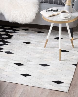 Tapis en cuir blanc et noir 140 x 200 cm MALDAN