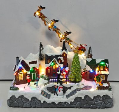 Village de noël lumineux patineur tournants et rennes Feeric Light & Christmas