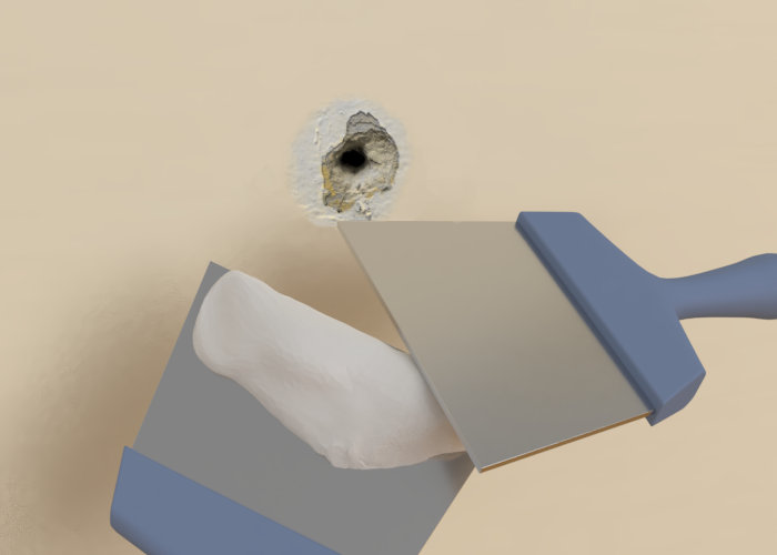 Travaille enduit avec spatule et trou dans le mur