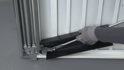 Préparer la porte de garage basculante