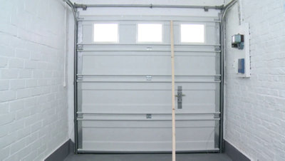 Régler la porte de garage sectionnelle