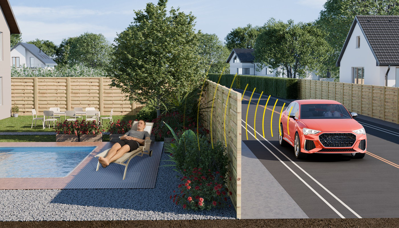 Un homme se repose dans son jardin près de sa piscine à l'abri des bruits de la rue à proximité grâce à une clôture