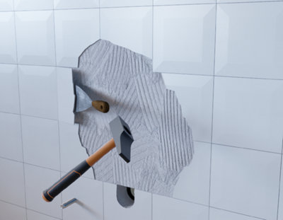 Casse des carreaux blanc avec une spatule et un marteau.