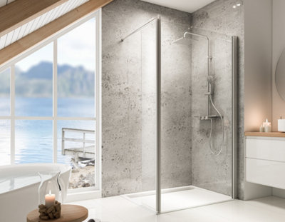 Une douche à l'italienne avec paroi fixe et volet de retour