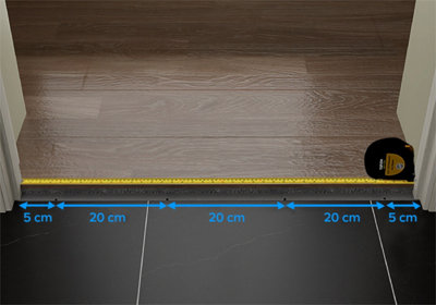 Indication en taille pour perçage et mètre ruban à côté