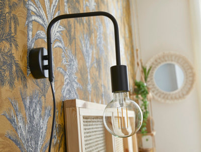Dispositif d'éclairage fixé au mur