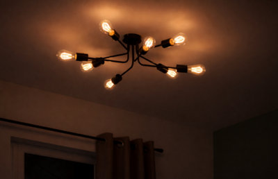 Plafonnier moderne noir style spoutnik à ampoules filamenteuses pour un éclairage chaleureux et un design contemporain. Sublimez votre intérieur.