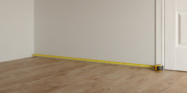 Mesure avec mètre longueur du mur